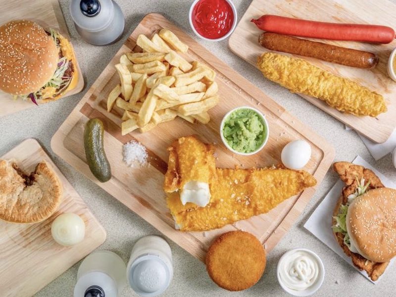 Battered fish with chips, mushy peas and tartare sauce